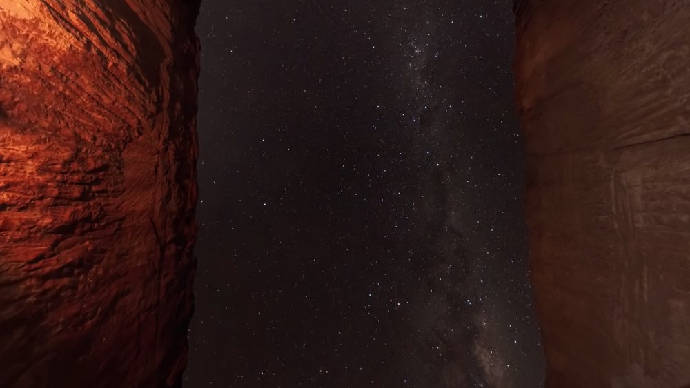 The galactic core framed between two walls of an opal cut.